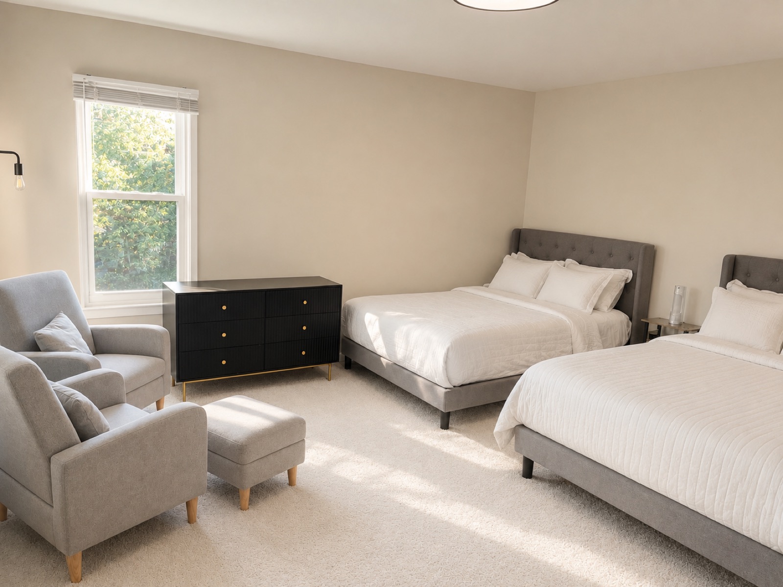 A spacious bedroom with two beds